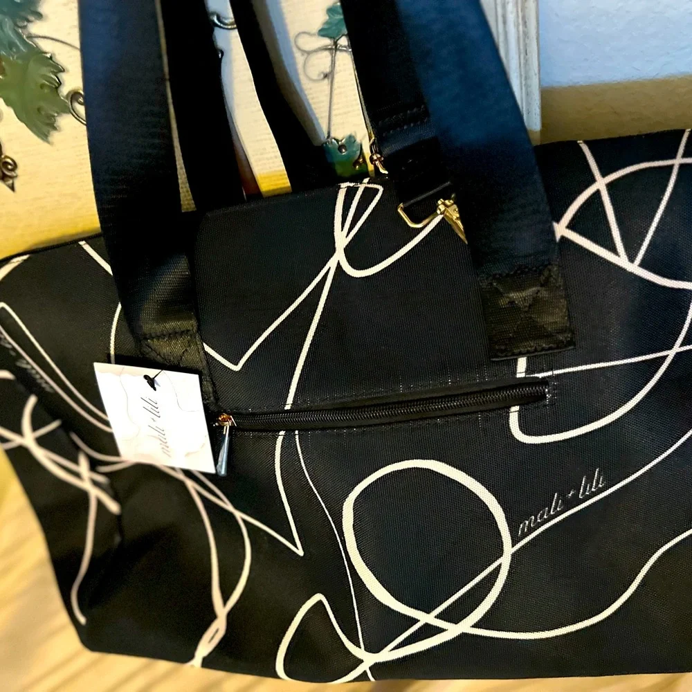 NWT Mali + Lili weekend bag in black and white design on canvas. Plenty of room